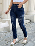 Vintage embroidery stretch skinny jeans for women – front view of dark blue butt lifting denim pants with white stitching on model