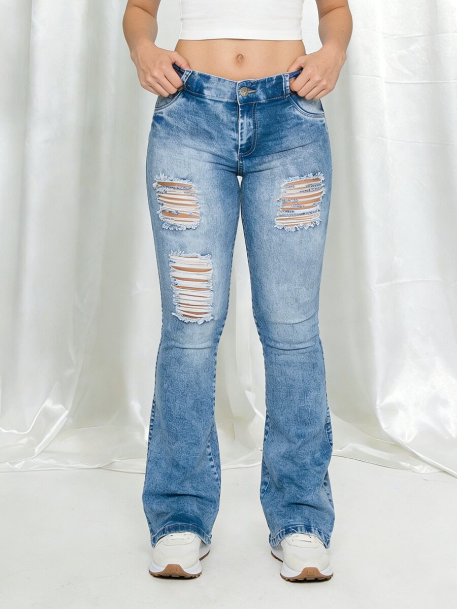 Butt lifting bootcut jeans with ripped design – back view of classic blue stretch denim pants showing sexy fit on model