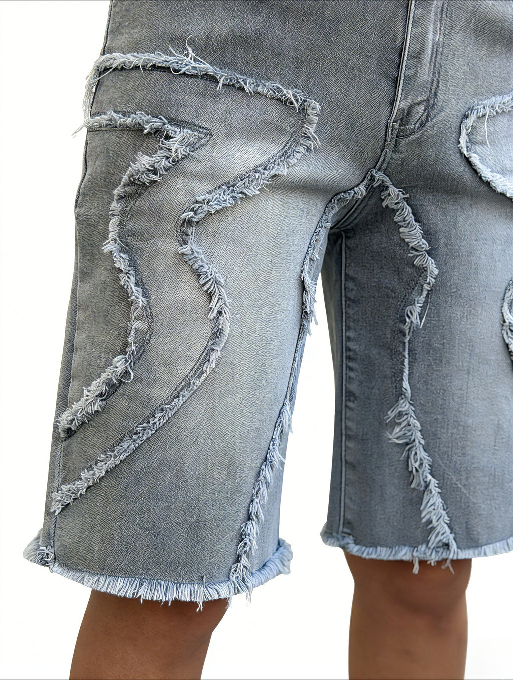 Close up of raw hem and stretchy denim fabric on classic grey wide leg shorts for women – relaxed jeans shorts detail shot