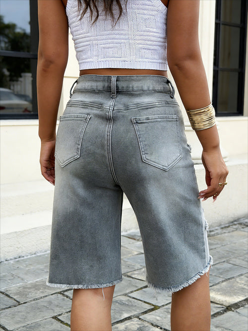 Wide leg grey denim shorts with raw hem – side view of stretchy classic jeans shorts showing relaxed fit on model