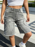 Classic grey wide leg denim shorts for women – front view of stretchy raw hem jeans shorts on model